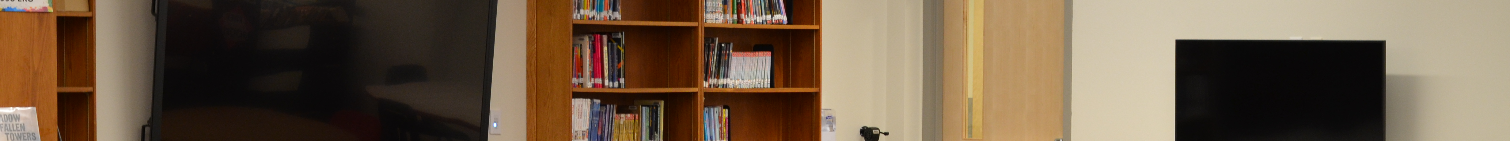 Perspective of looking into the media center breakout table in the library at john adams middle school