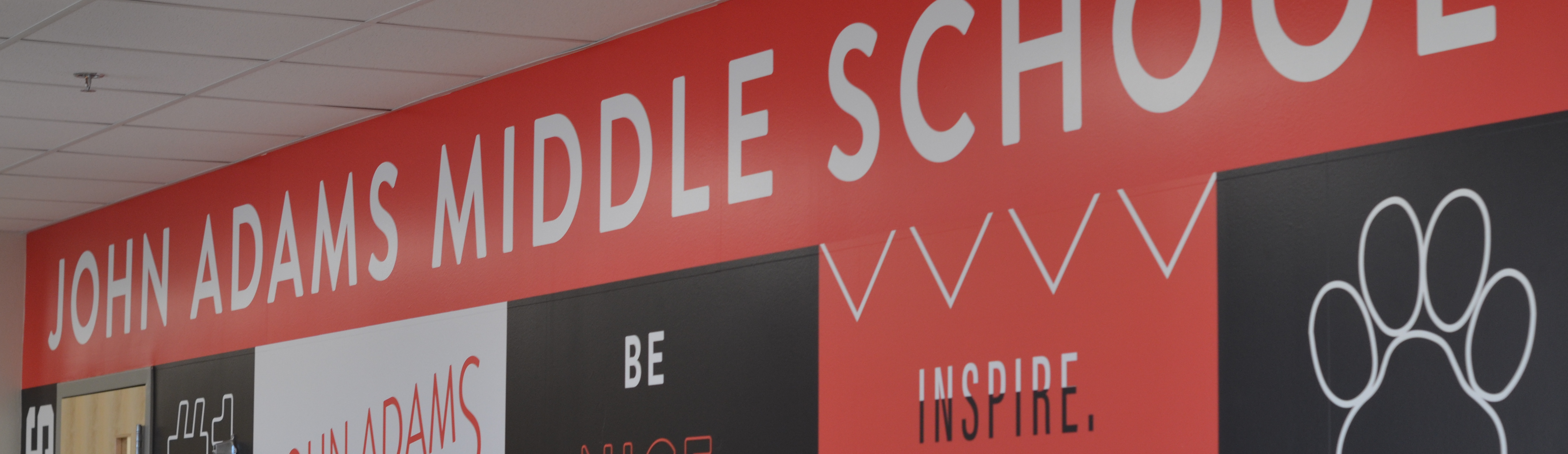 Graphic wrapped wall near the front office of John Adams Middle School.