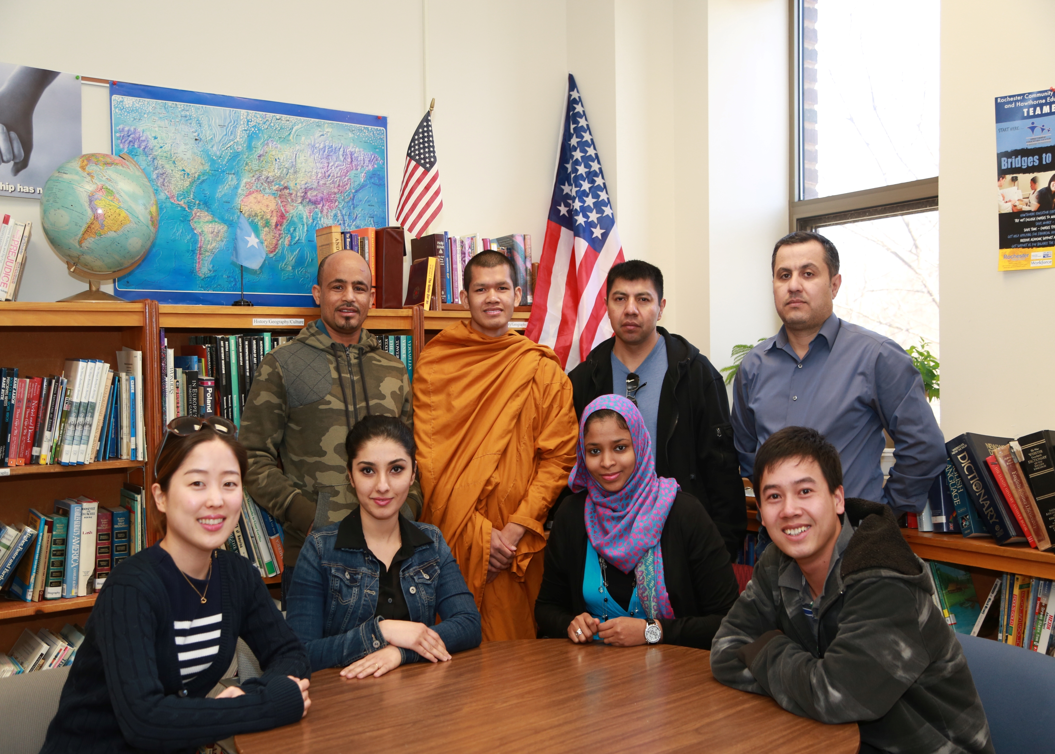 a multicultural group of adults in a classroom