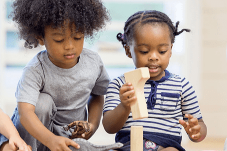 young kids playing with blocks