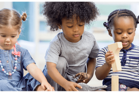 young kids playing with blocks