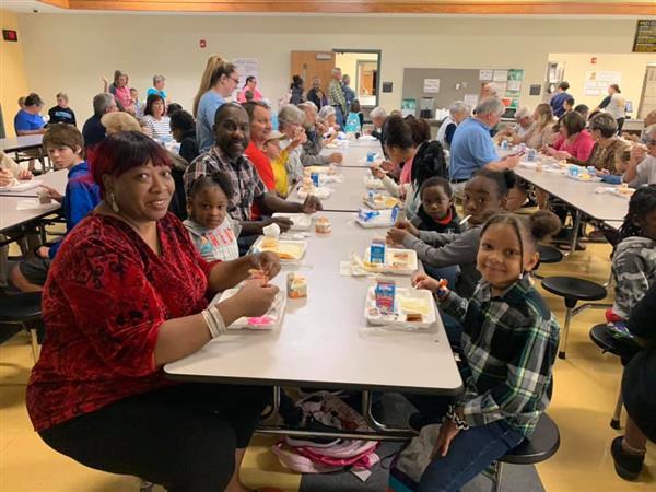 Grandparents with students at school 