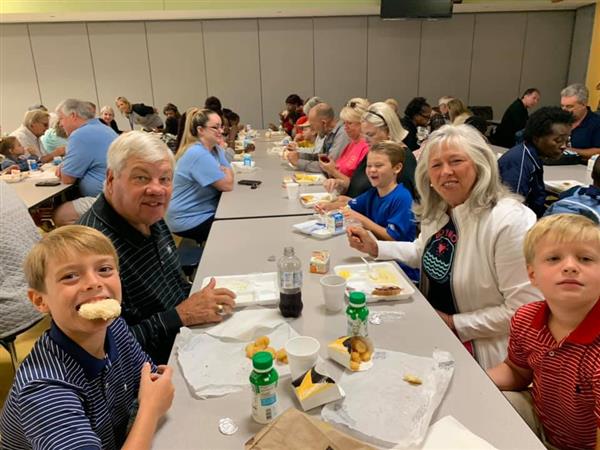 Grandparents with students at school 