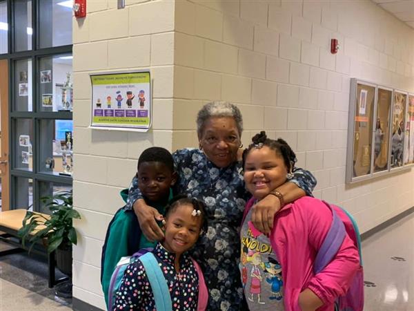 Grandparent with students at school 