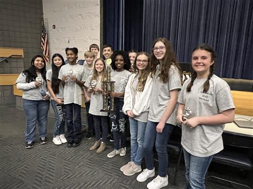 students with trophy 🏆 