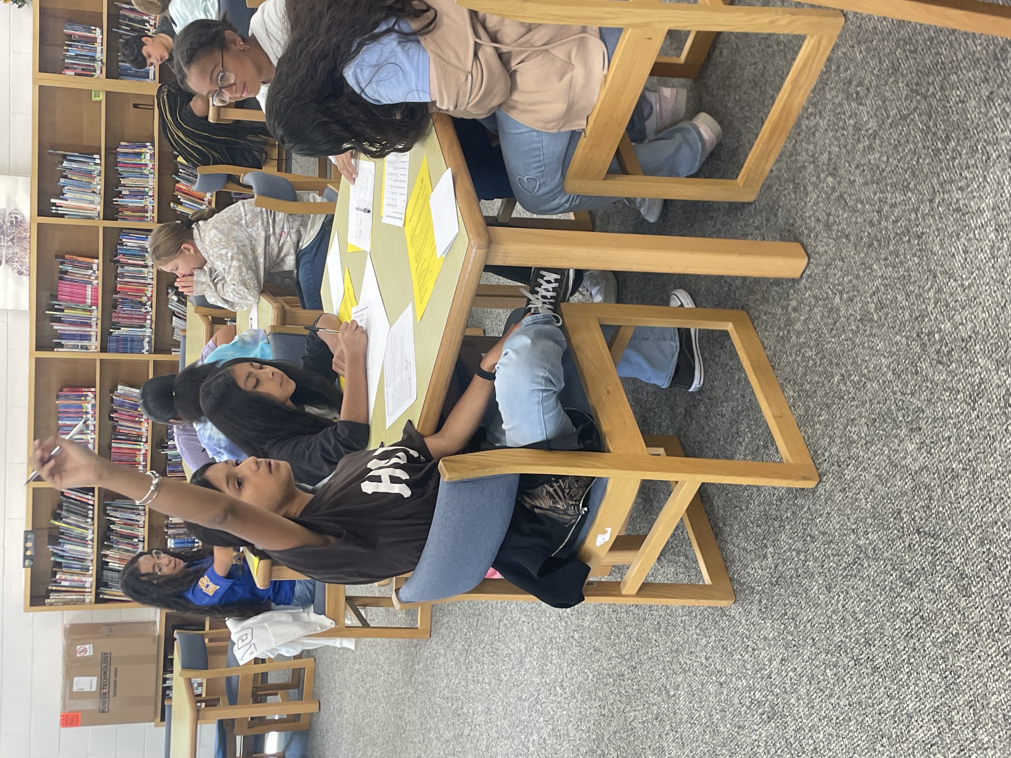 Ms. Carter meeting with the yearbook club