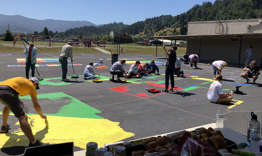 people painting the floor