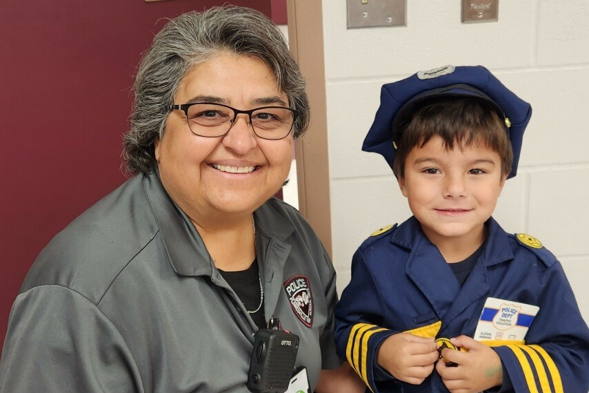 officer with student in costume