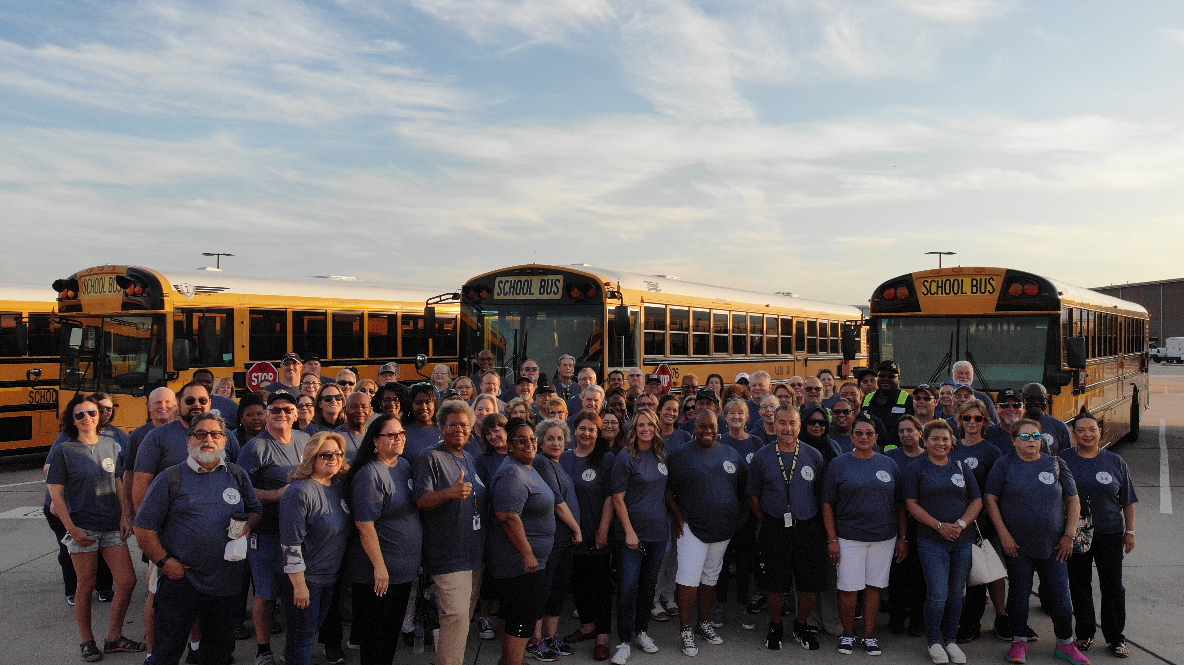 Transportation Department staff photo with buses