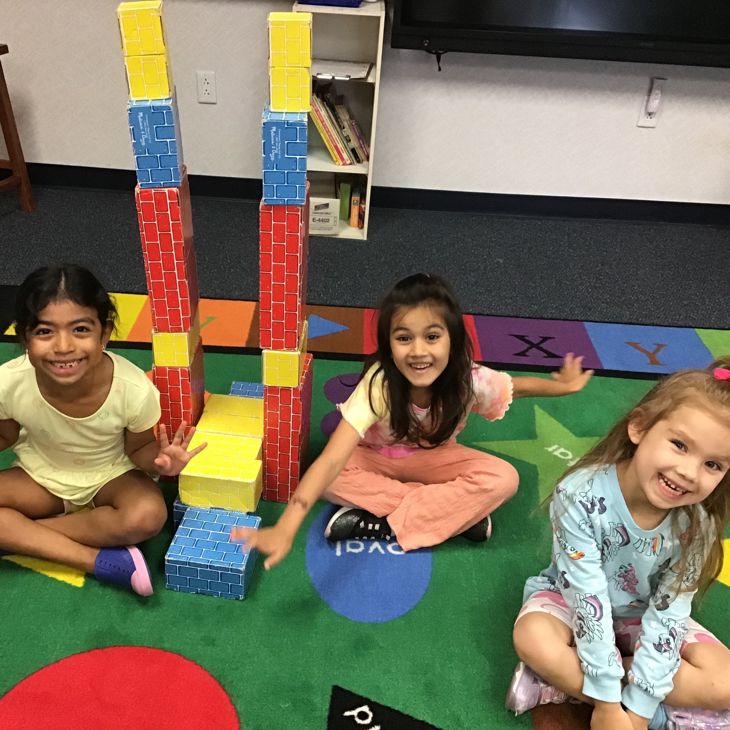 Students playing at the block center.