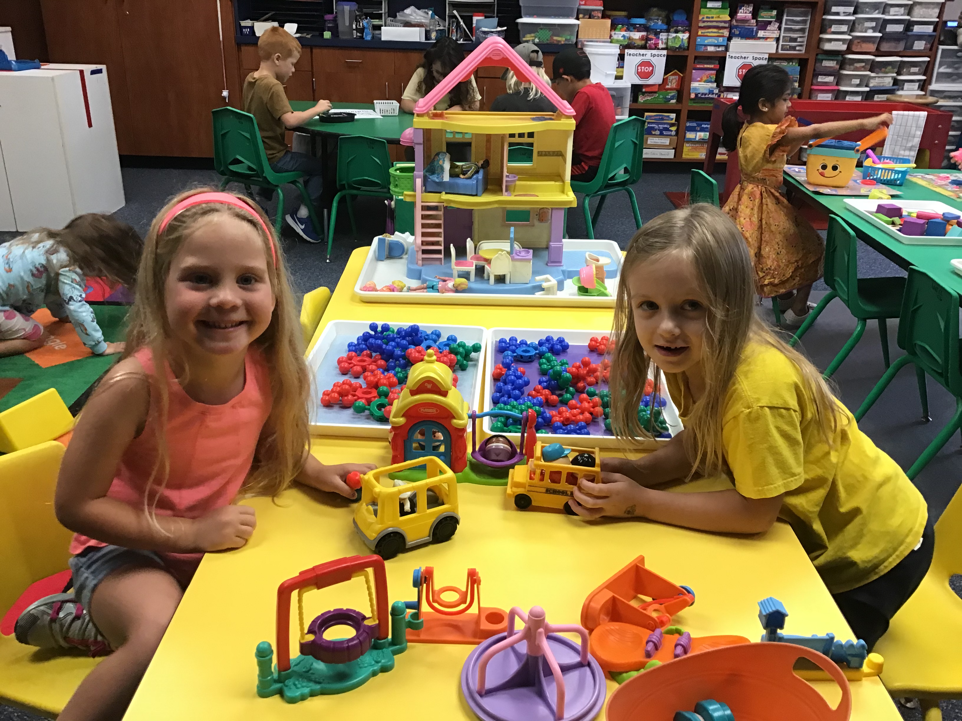 Students playing with the Little People playset 