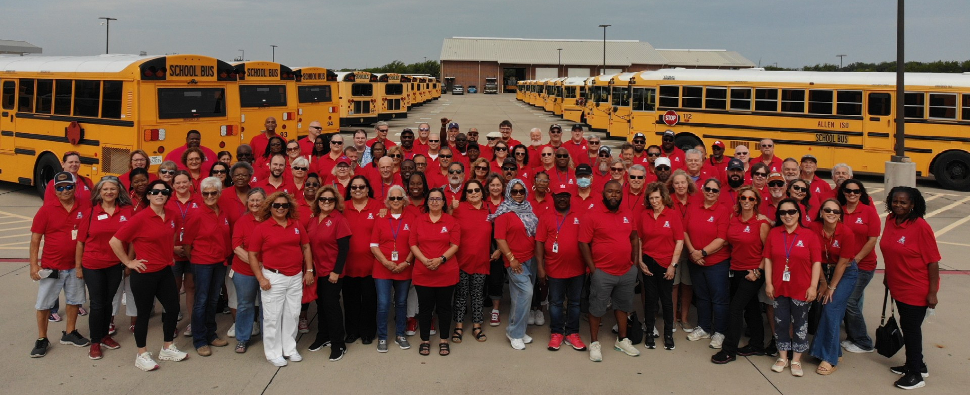 Transportation Department staff photo with buses