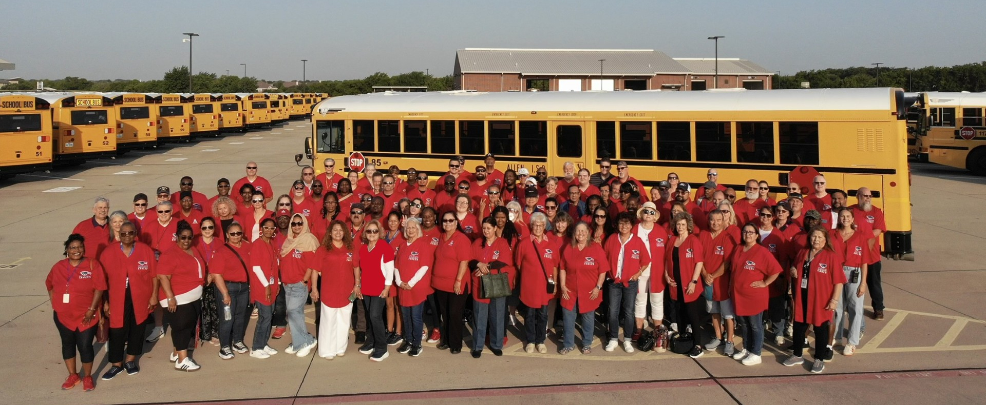 Transportation Department staff photo with buses