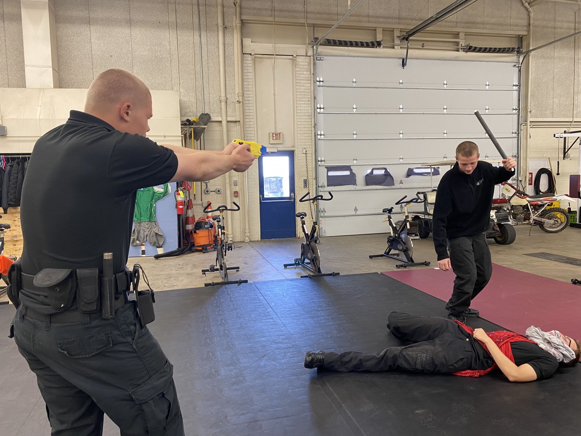 Officer training with two other participants