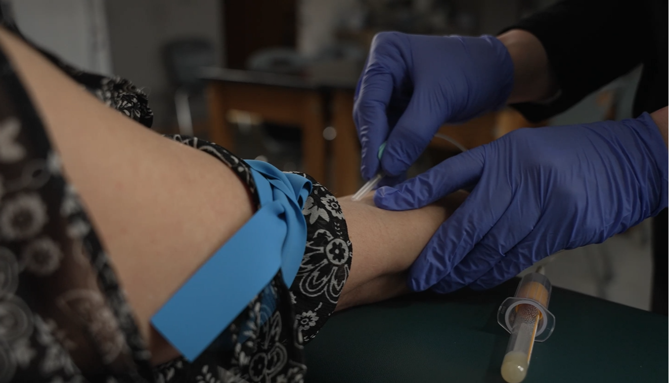 person having blood drawn