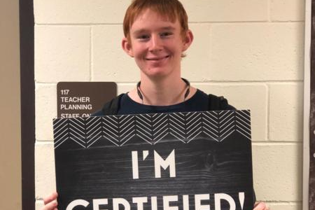 students holding sign