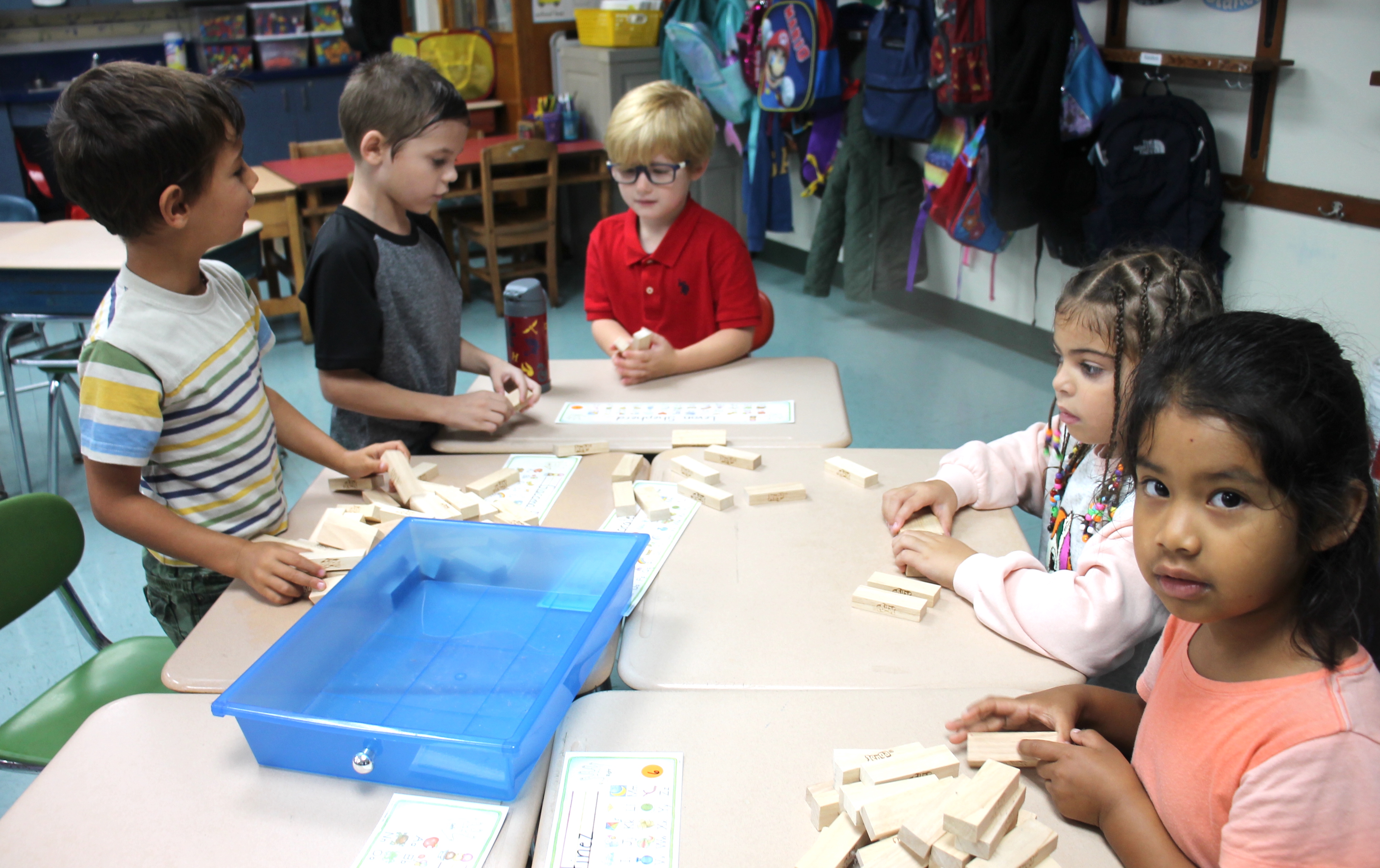 elementary school children working at a table