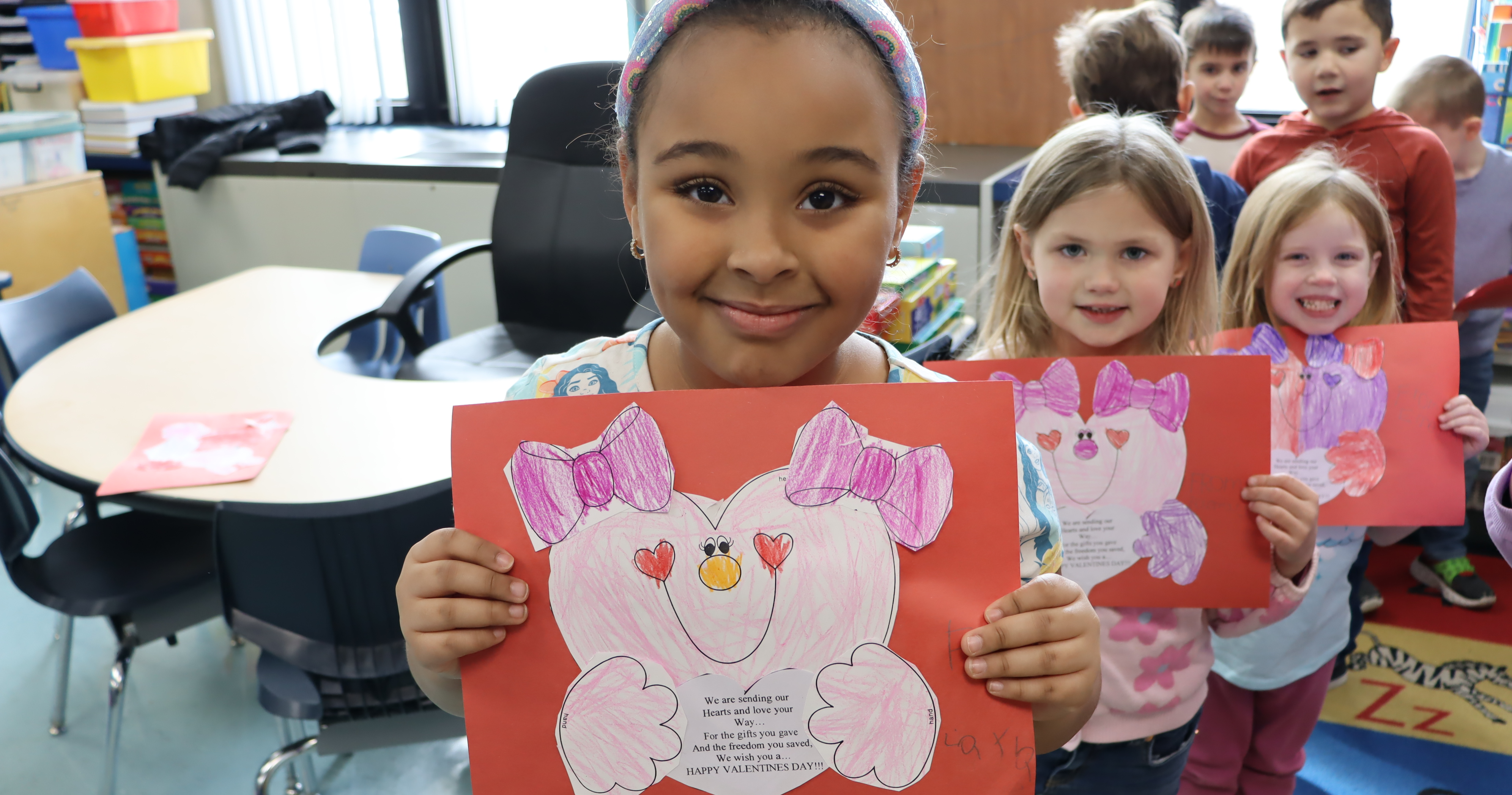 A student holding a valentine card