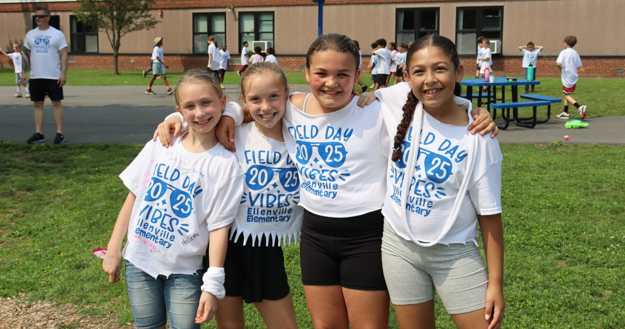 Four students posing outside