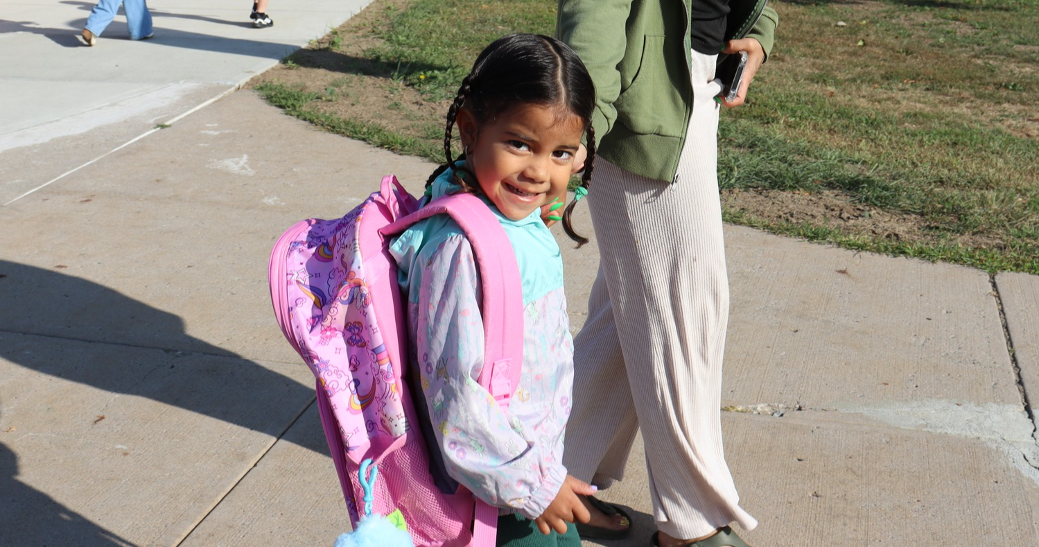 A student being waked into school