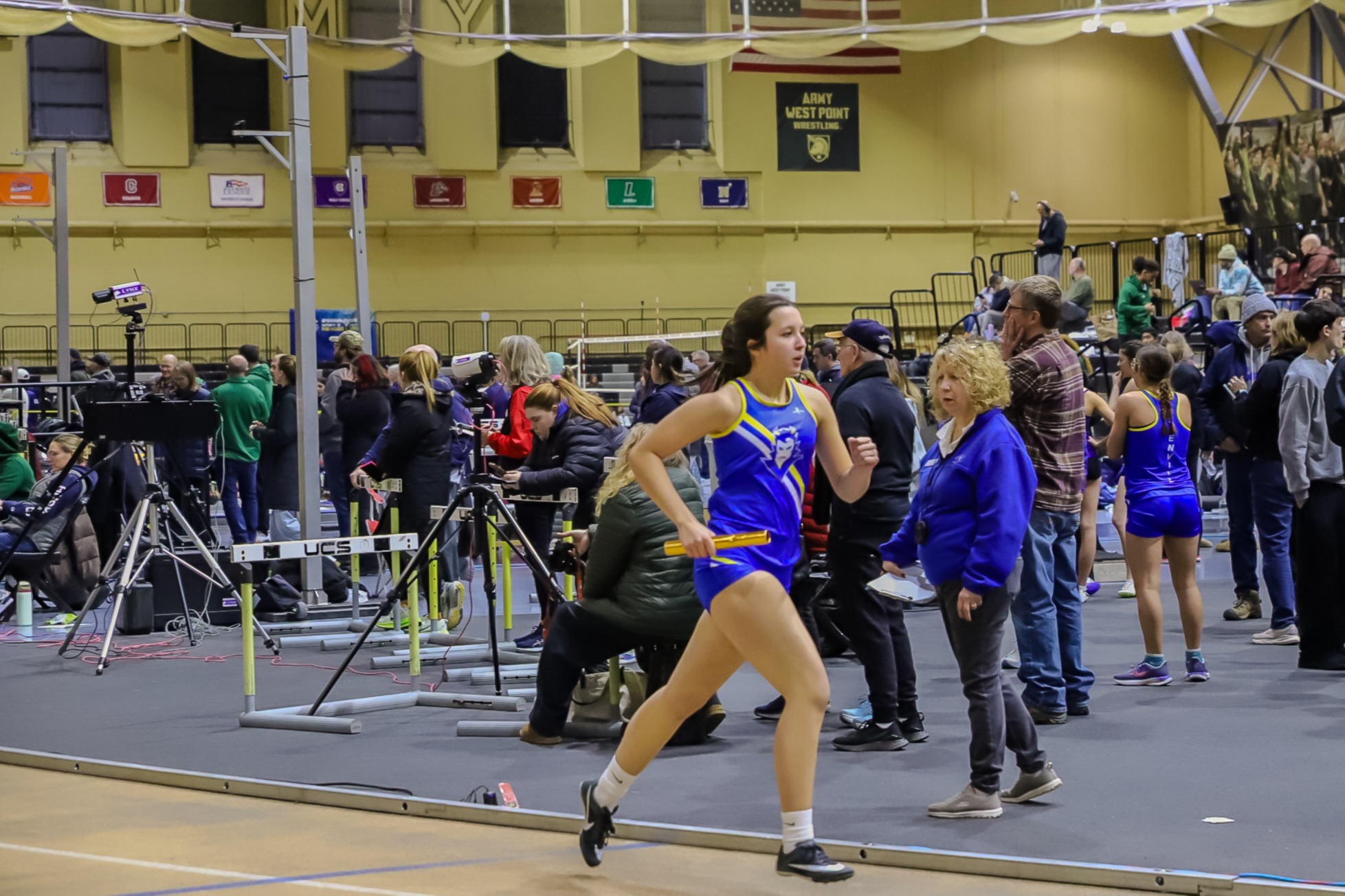 Girls track team member running