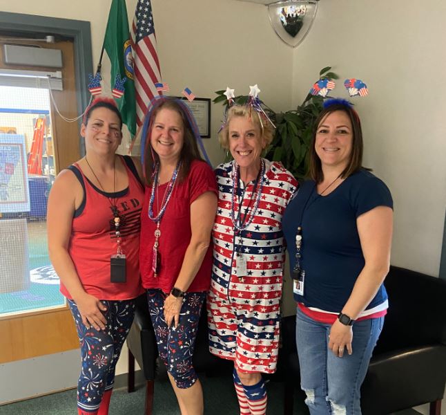 GBE staff posing for spirit day - 4th of july