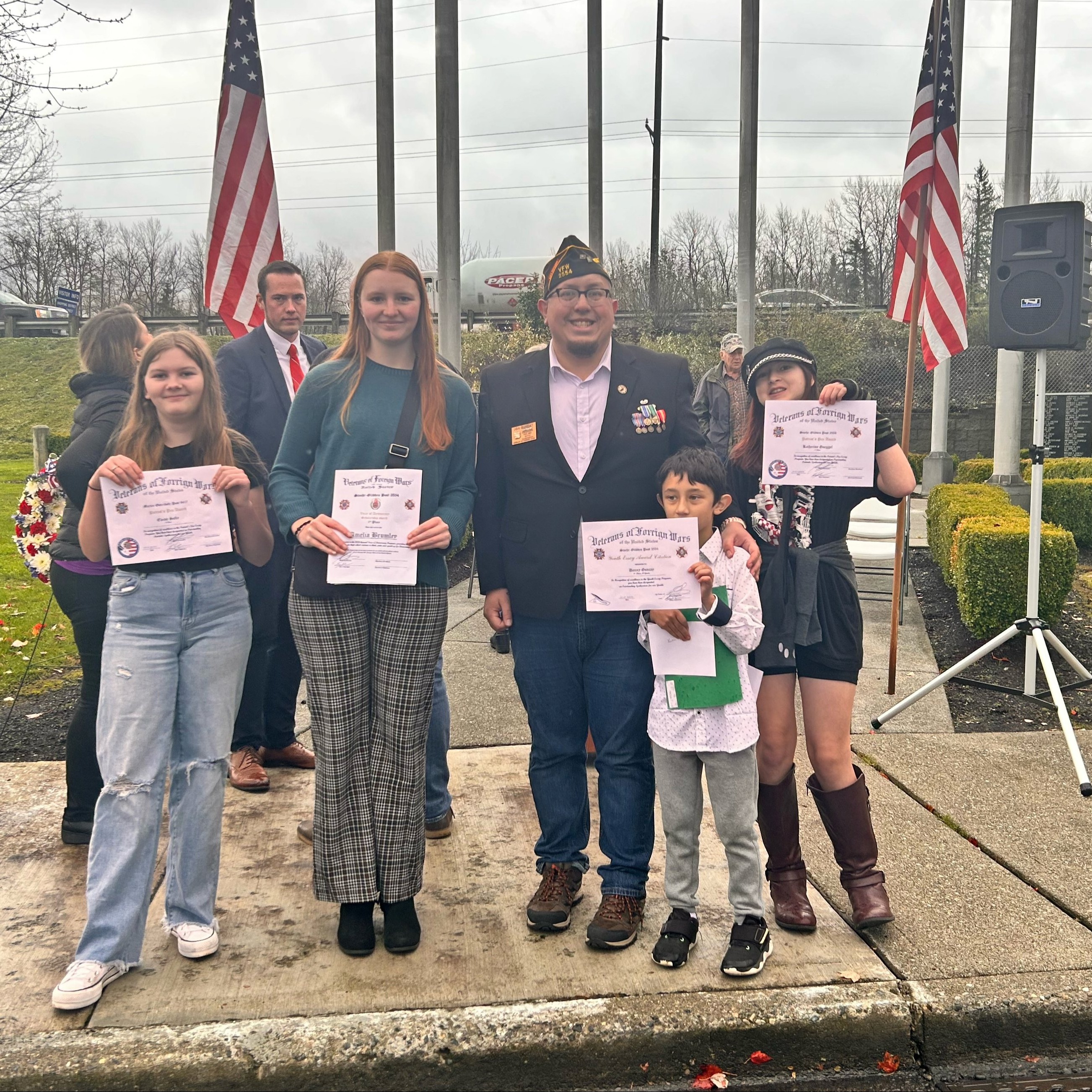 students posing with awards for Patriot Pen essay.