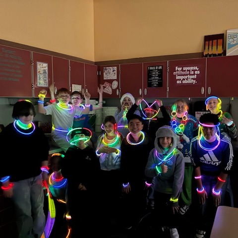 students with glow sticks
