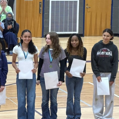 Honors students holding certificates.
