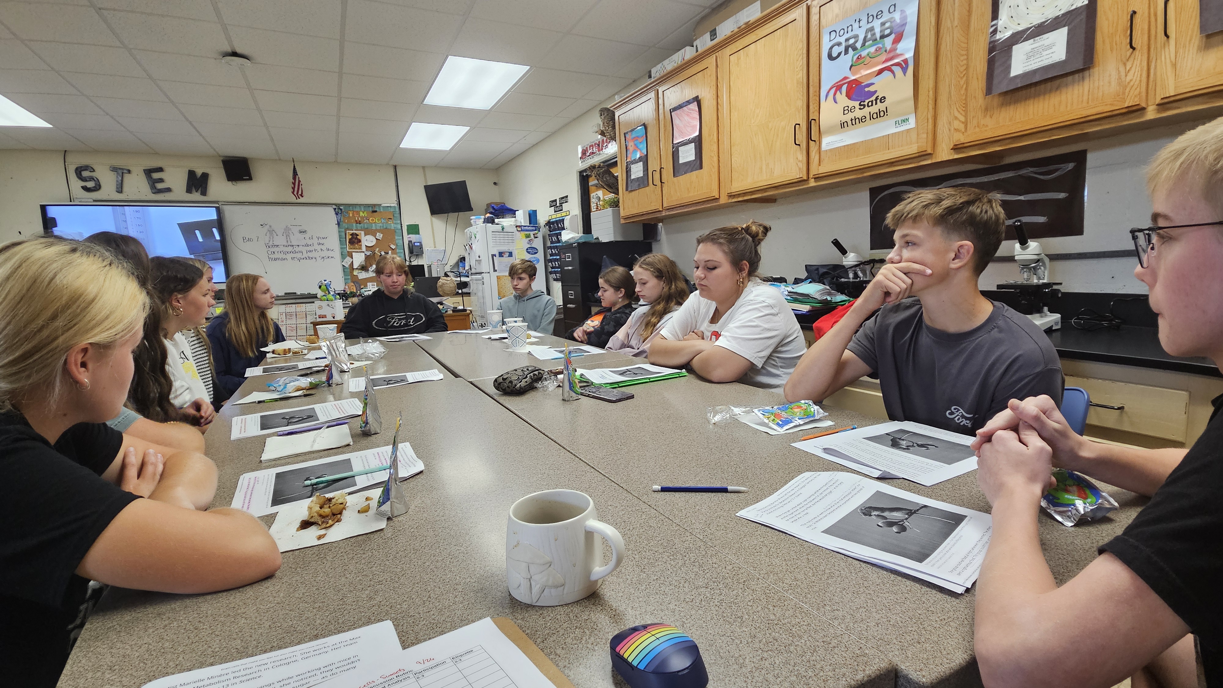 A group of students are discussing a science topic