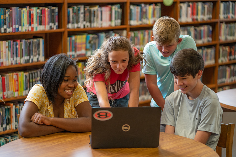 Students playing on a laptop