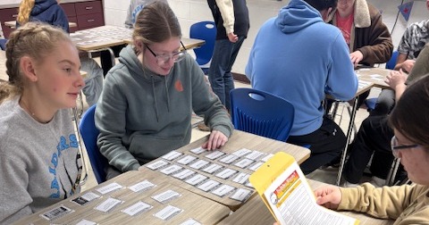 Students are sequencing items at their desk for social studies. 