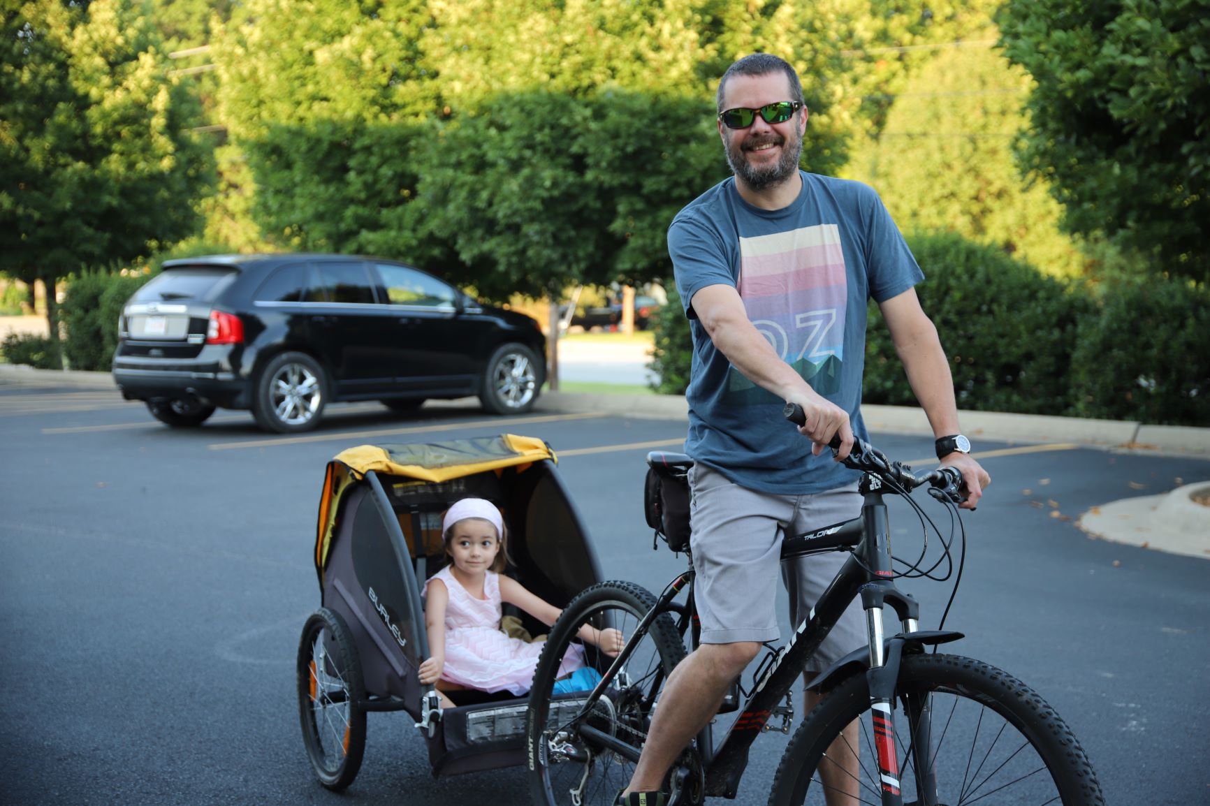 Dad and child biking to school!