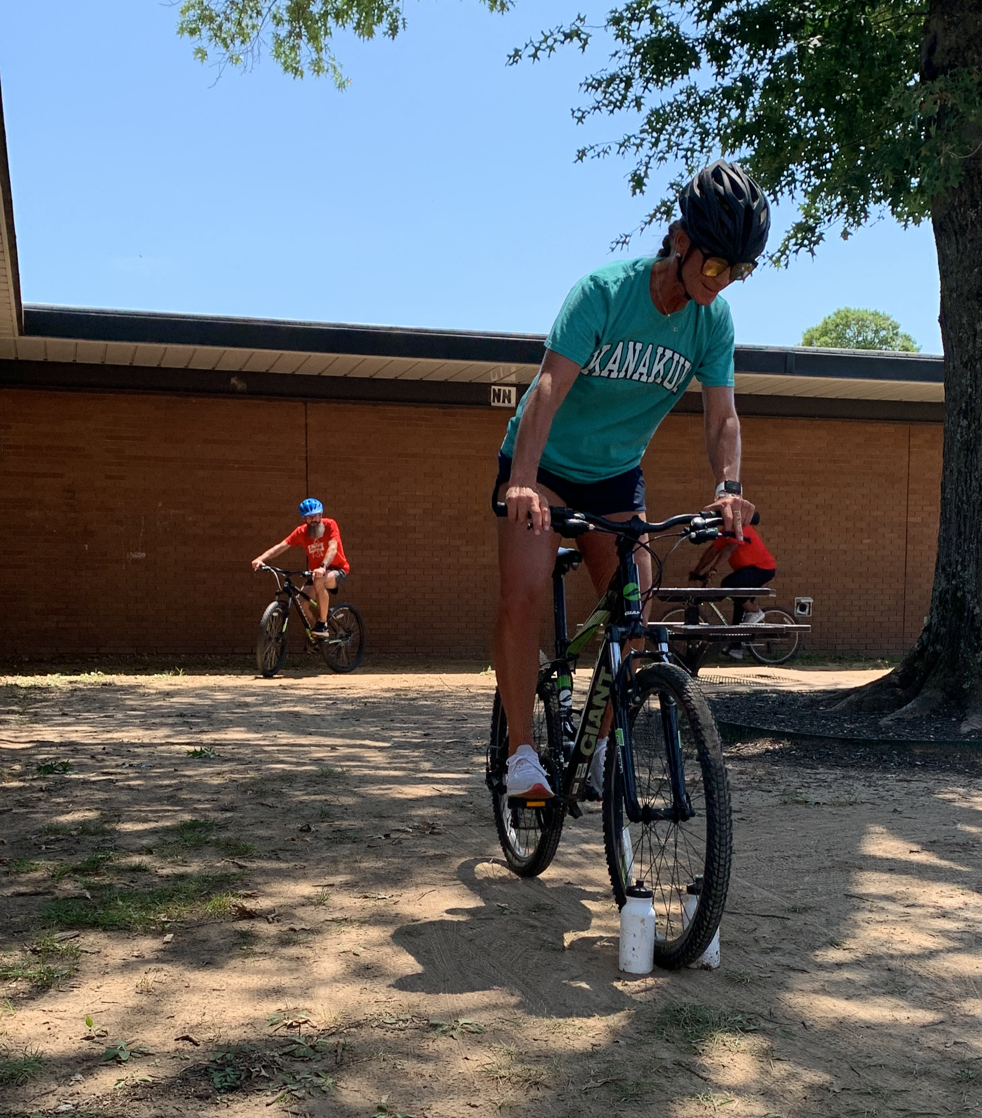 PE Teacher Playing Between the Bottles