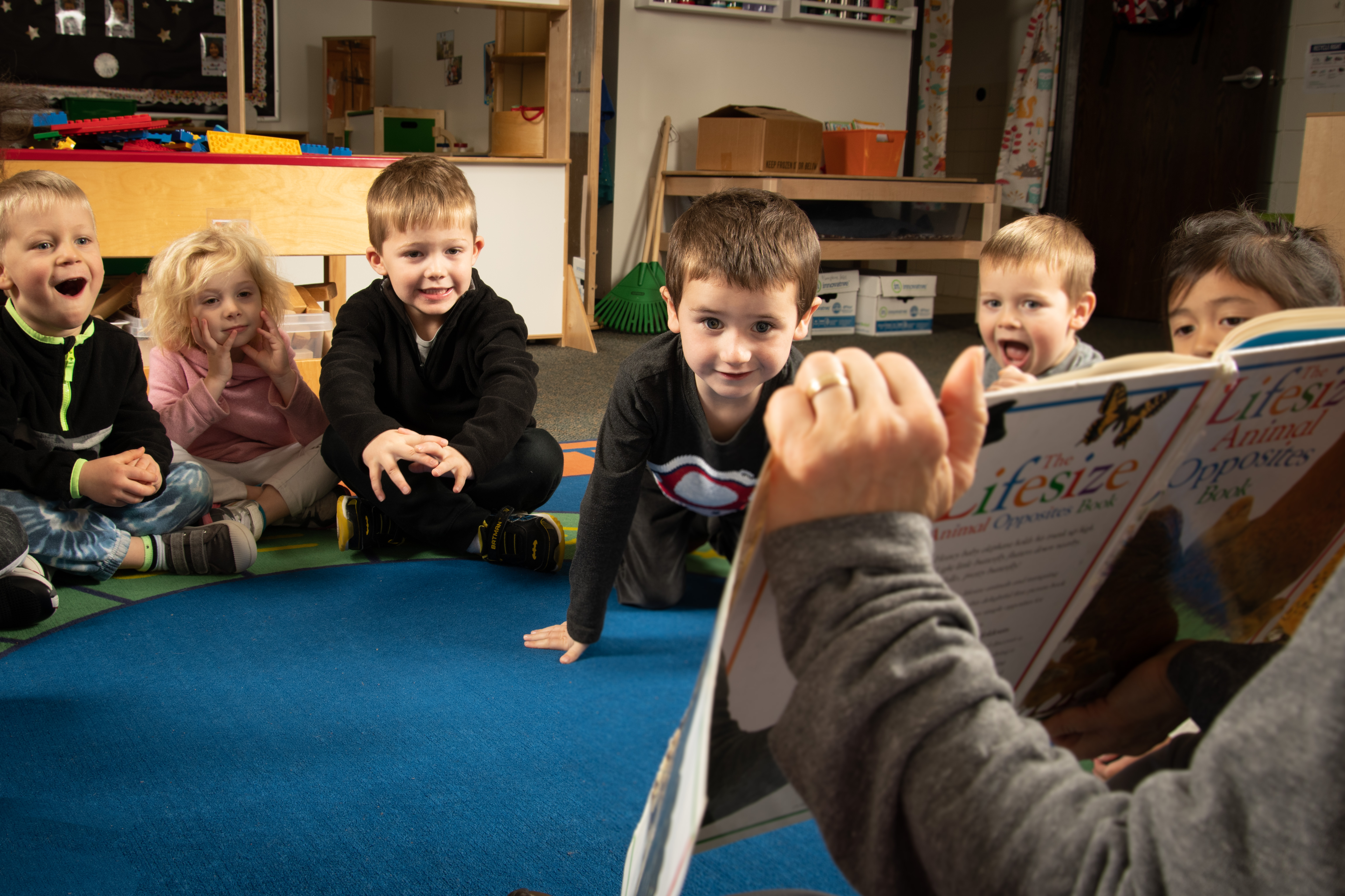 preschool students being read to