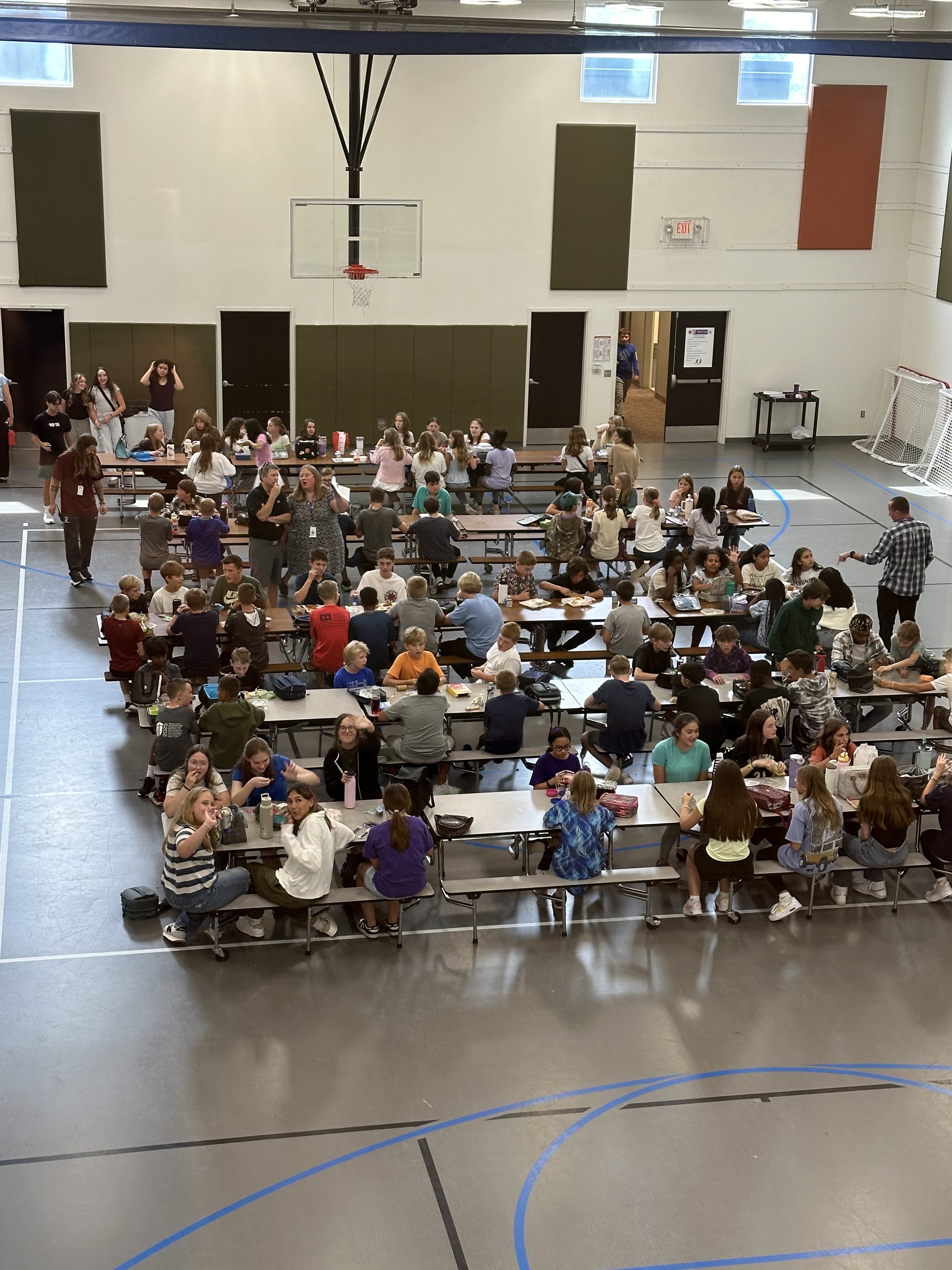 middle school stidents eating lunch in a cafeteria
