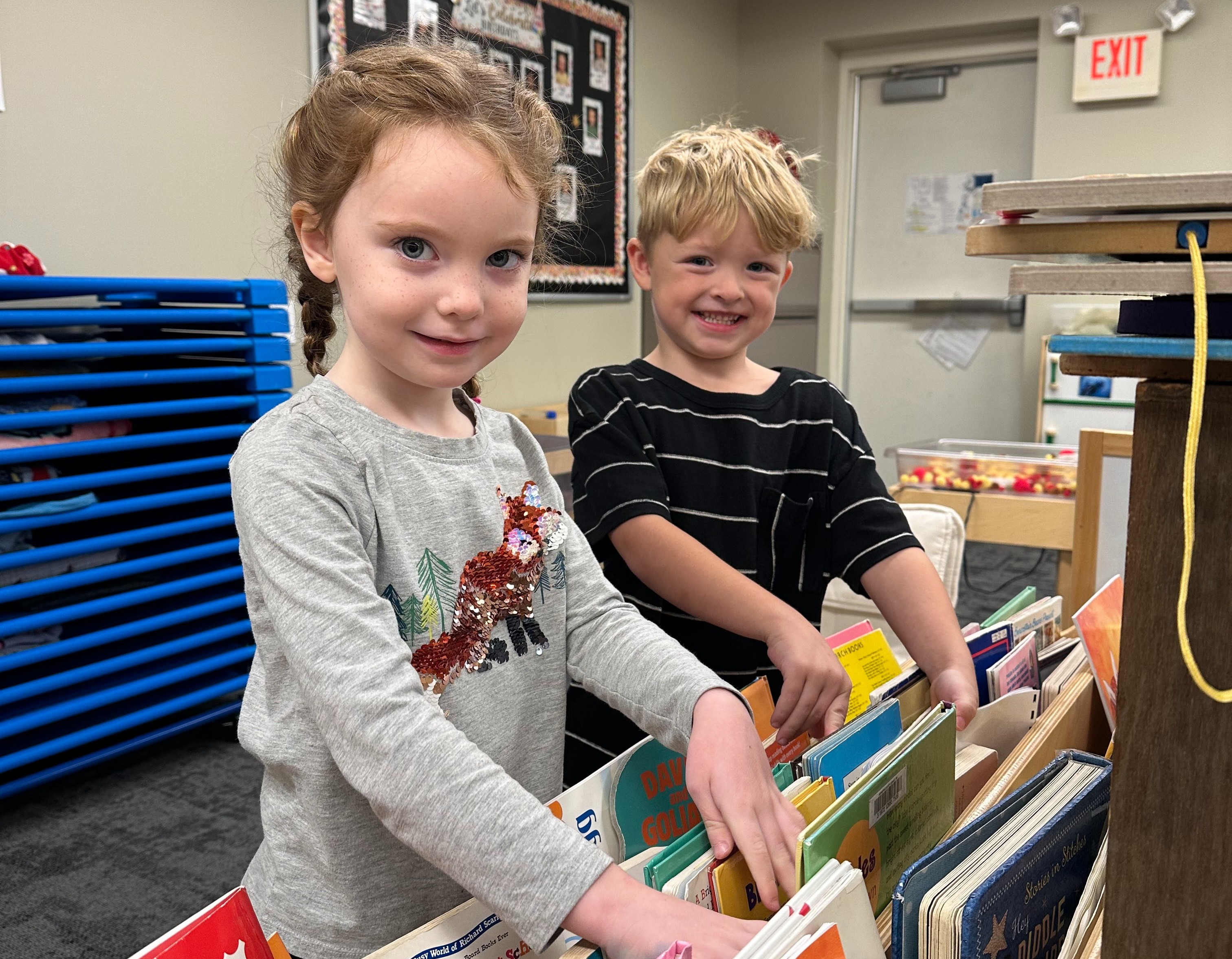 PreK students choosing books