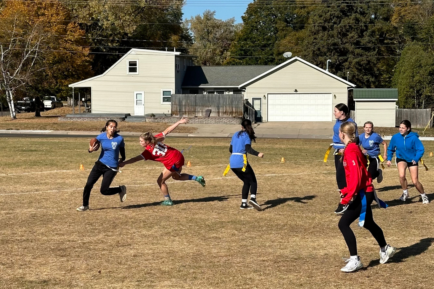 high school girls playing flag football
