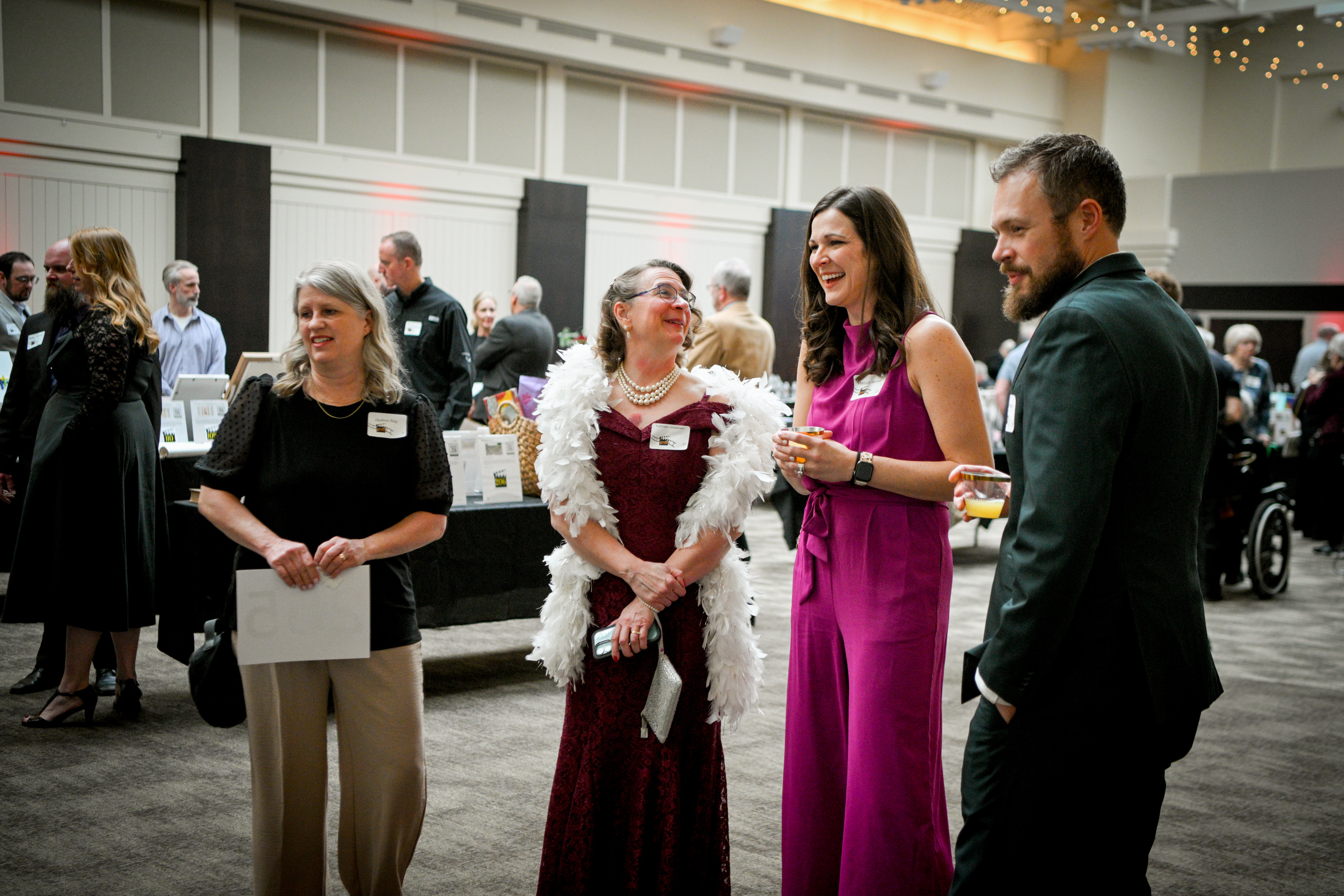 group of adults mingling at a fundraising event