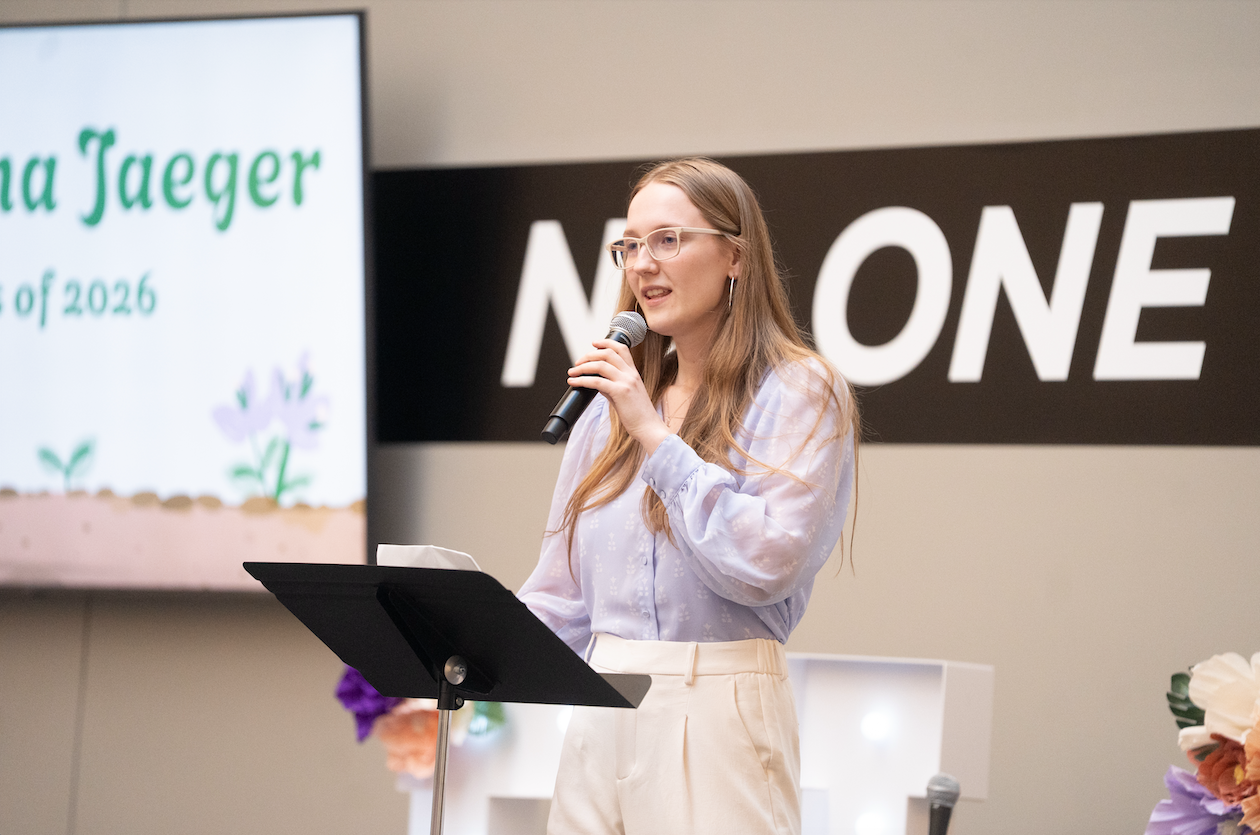 student speaking on stage