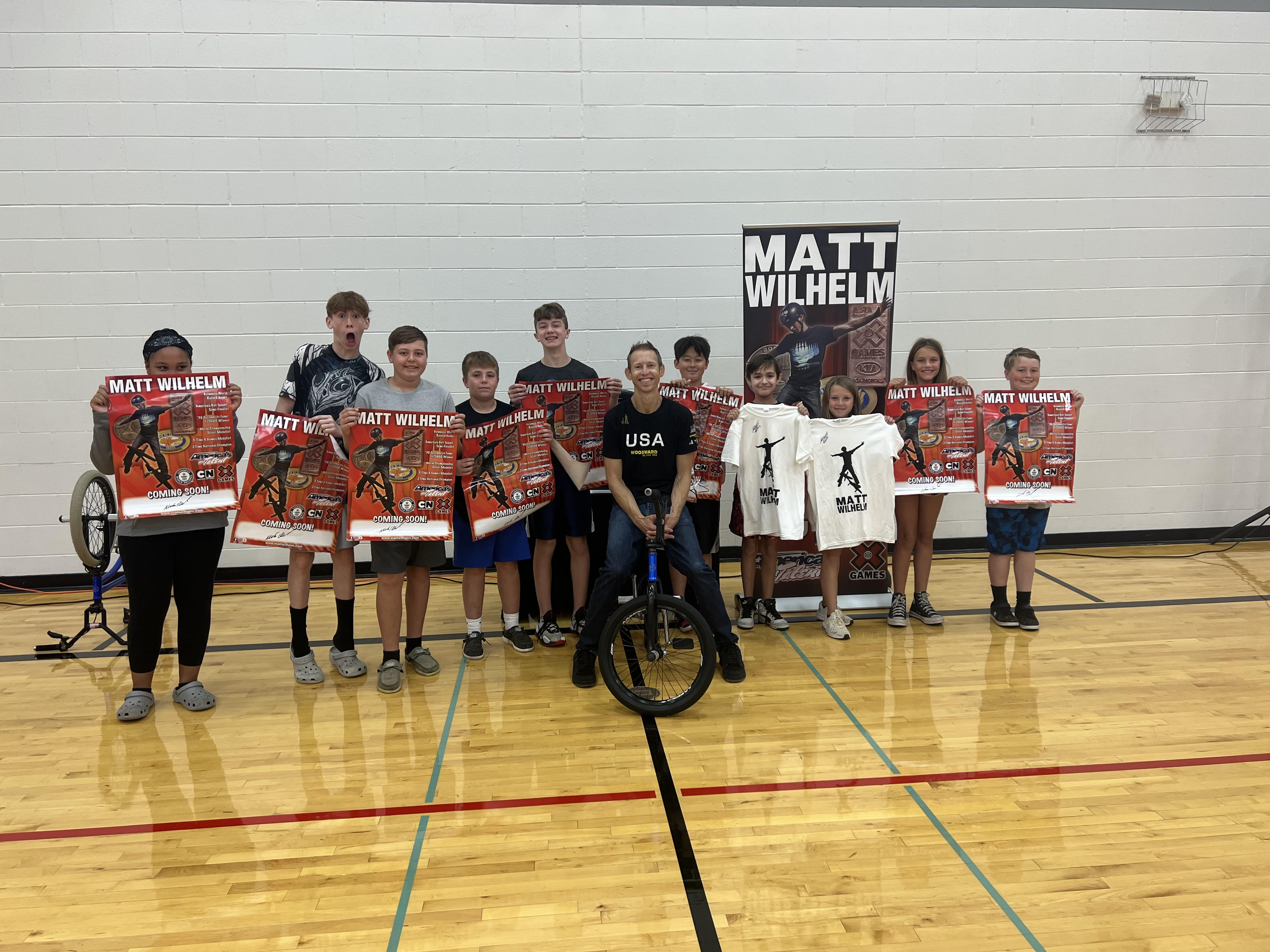 Students with Matt Wilhelm getting autographs after the assembly.