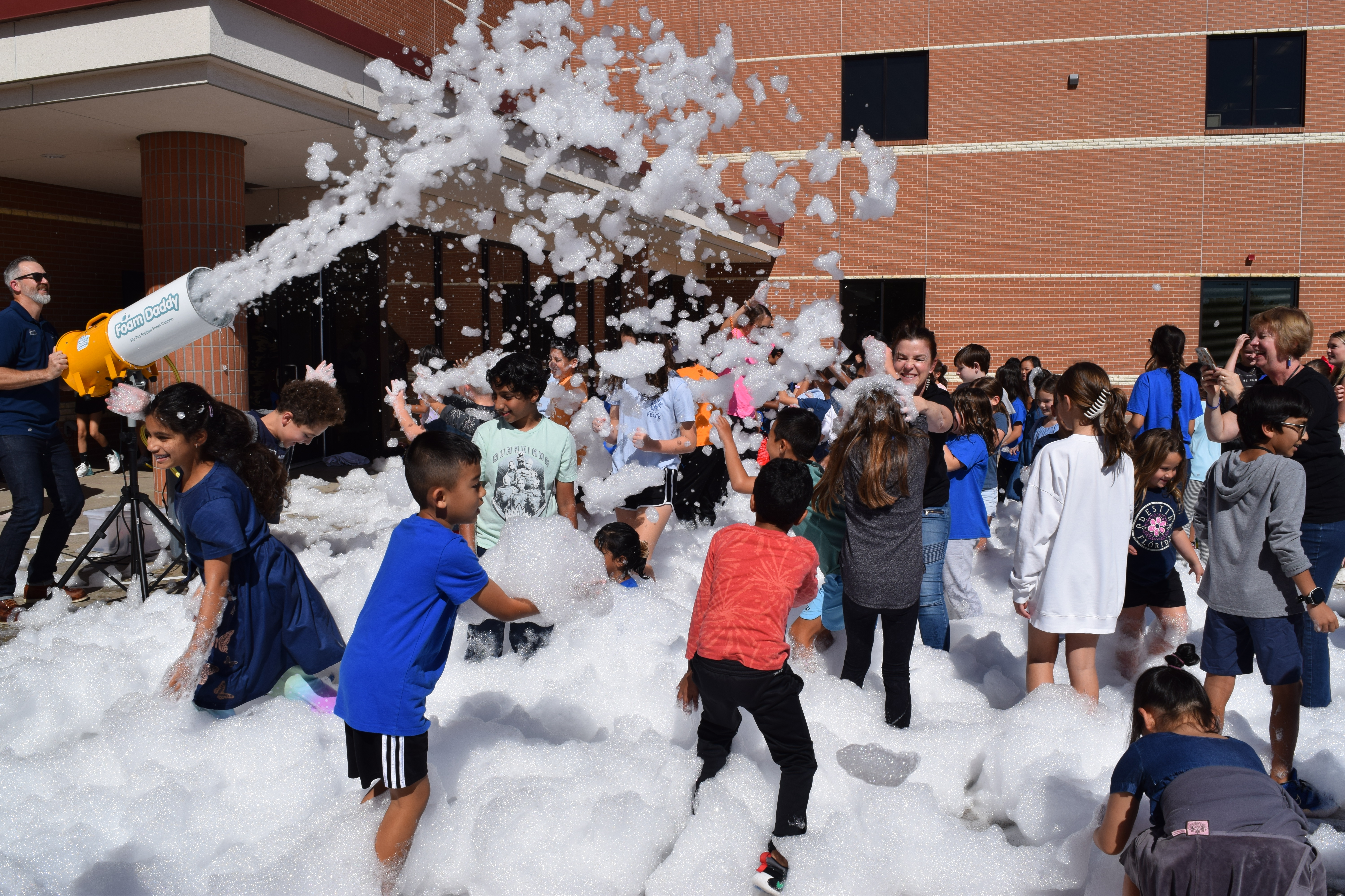 students playing in foam