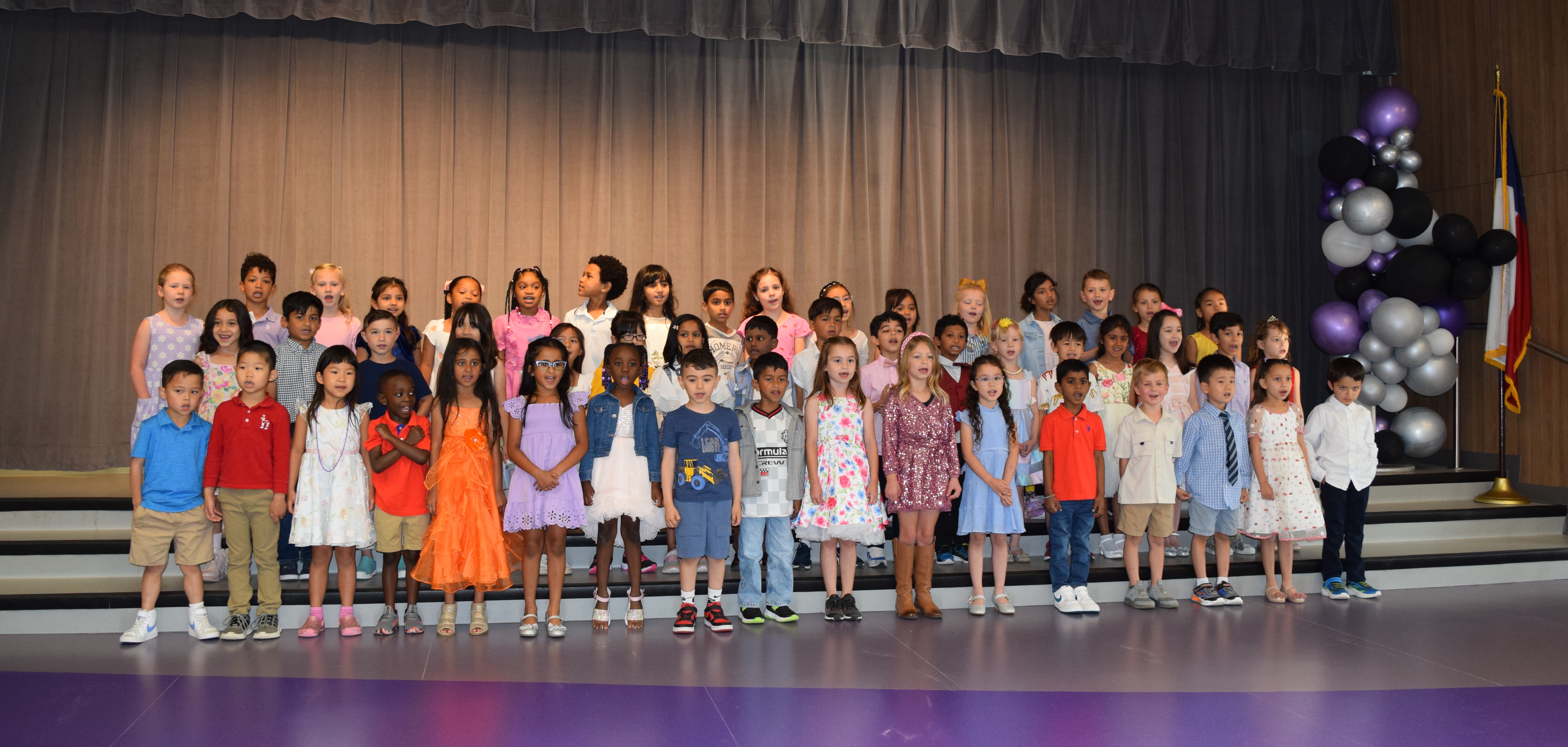 kinder students on stage
