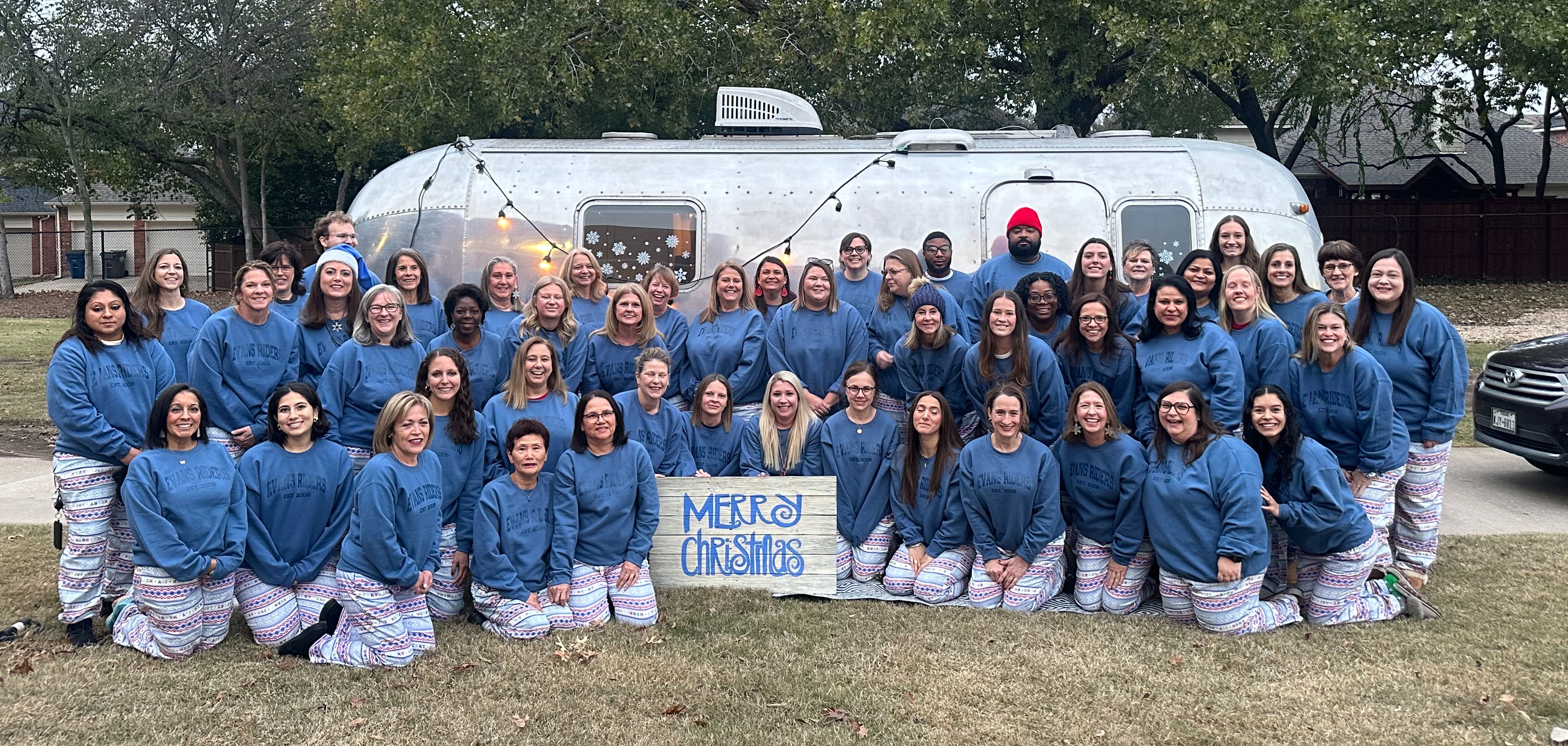 staff in front of a camper