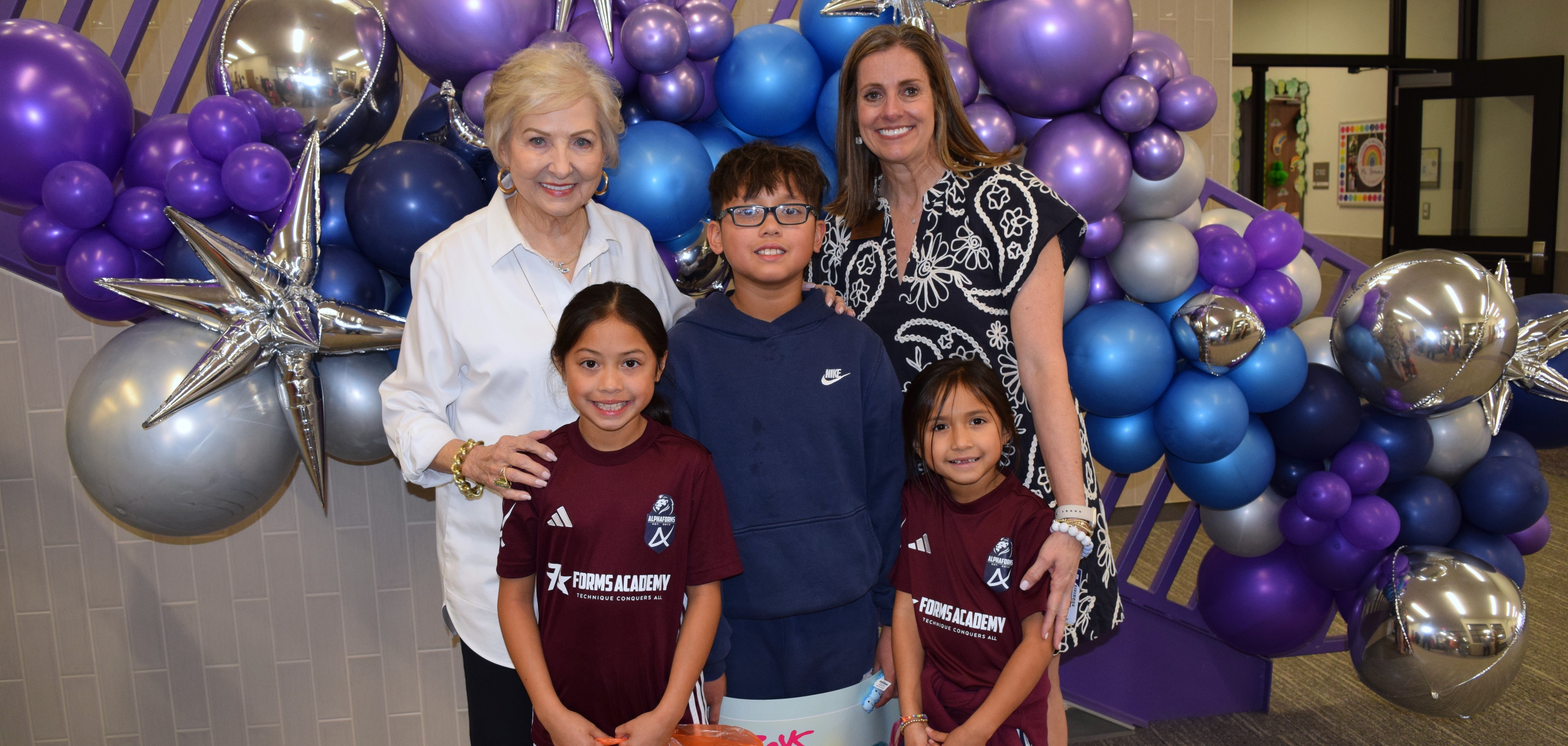 students, principal and Mary Evans at open house