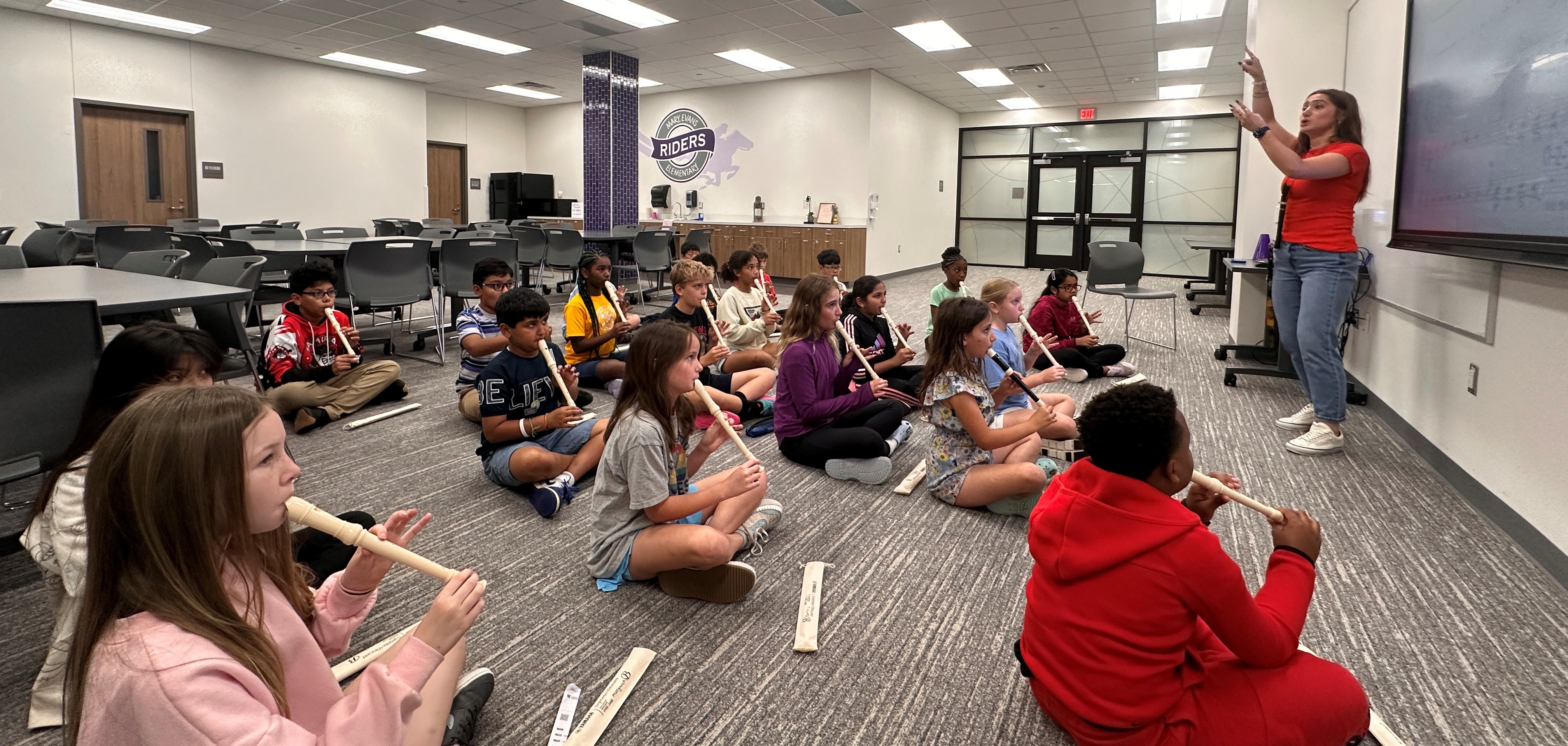 students playing the recorder
