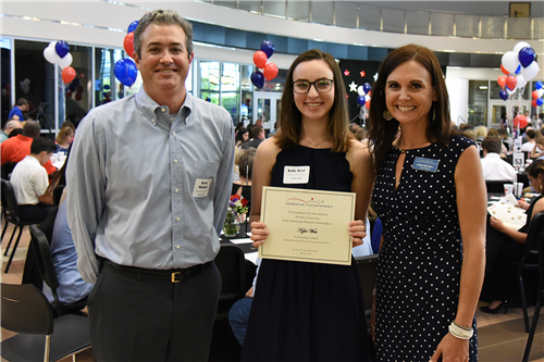 Emily Stambaugh Memorial Scholarship – $500 Kylie West with Coach Brent Mitchell and Sarah Mitchell, representing the AHS Swim and Dive Team Booster Club