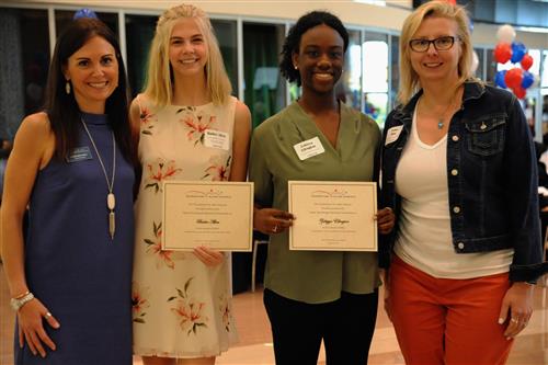 Emily Stambaugh Memorial Scholarship - $500 each Bailee Allen and Zakiyya Ellington with Sarah Mitchell and Dawn Blue, representing the AHS Swim and Dive Team Booster Club  