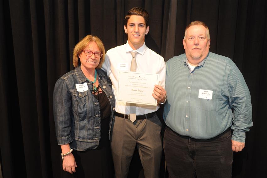 Harlie Dickinson Annual Football Scholarship - $2,000 Connor Limpert with donors Robin and Steve Sedlacek  