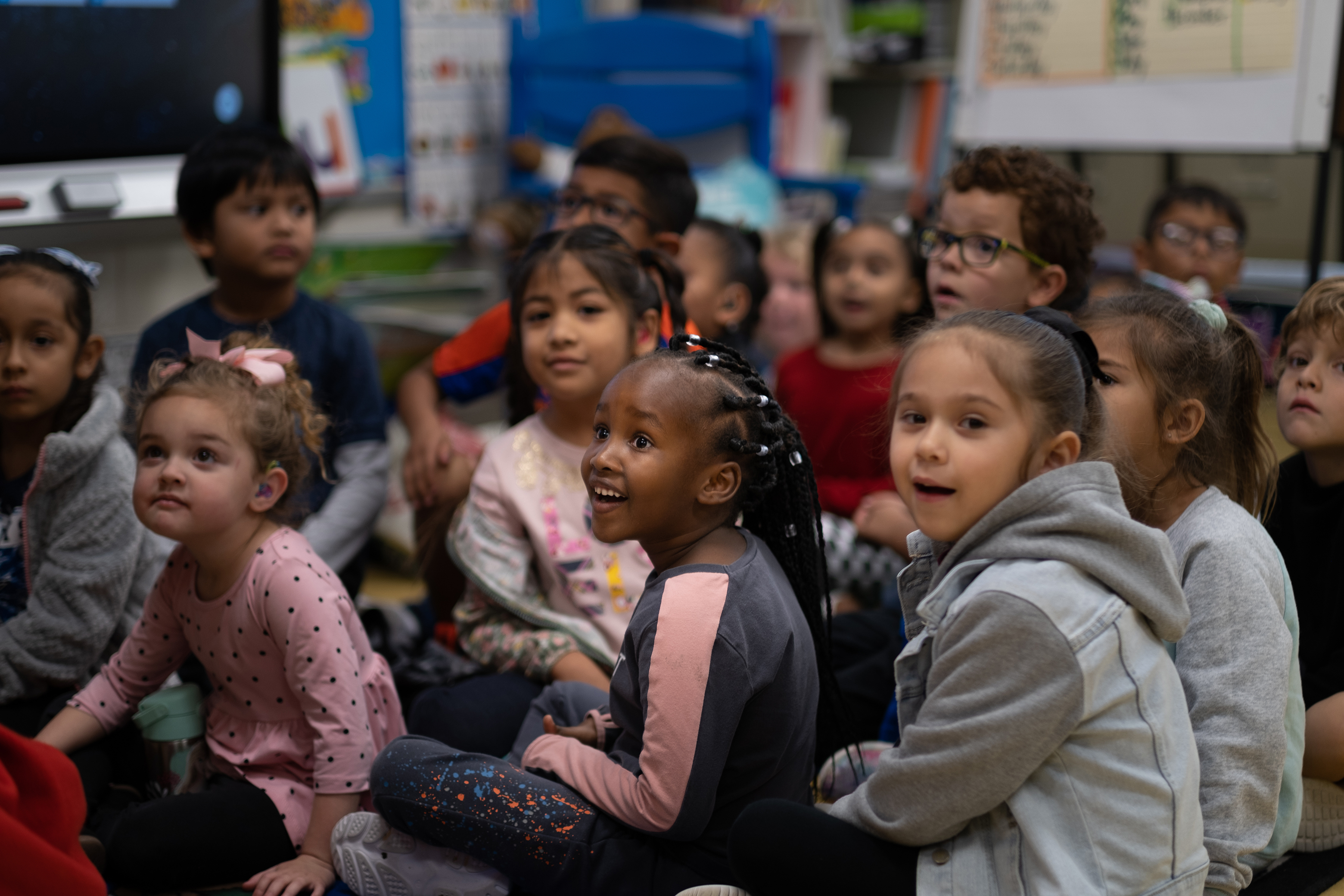 Group of kids sitting at the floor